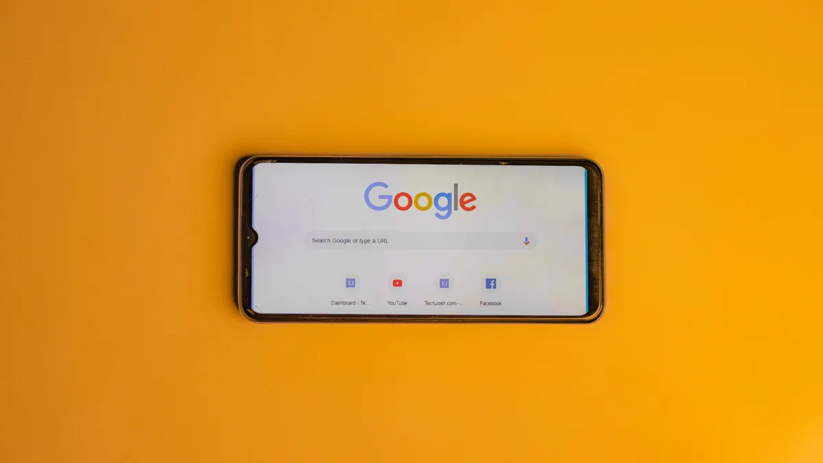 Bing vs Google ranking: key differences SEOs must know when optimizing — Smart Phone with a Google Search Page on its Di